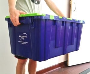 Man holding convenient plastic packing crate in Perth.